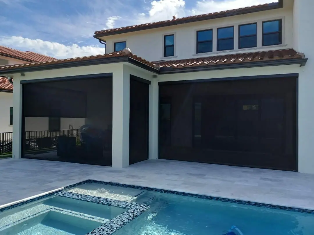 A pool with a swimming area and a house