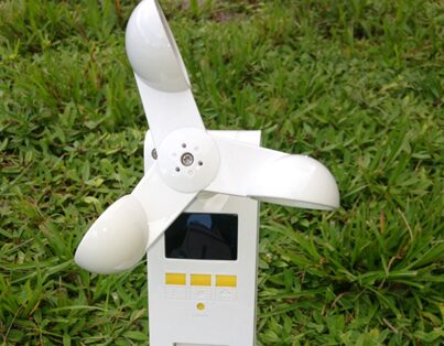 A white device with two blades on the outside of it.