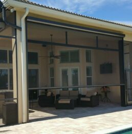 A patio with an awning over the top of it