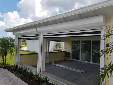 A patio with sliding glass doors and a ramp.